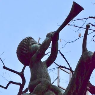 Statues of children riding fish and snail